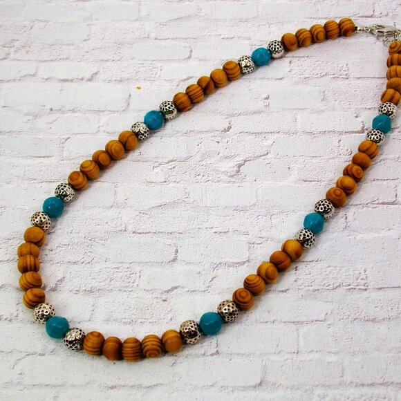 Wood bead necklace created with turquoise color beads and textured silver beads. - Picture 4 of 11